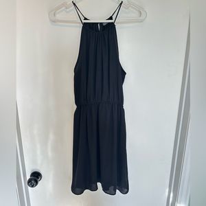 Black flowy dress with spaghetti straps.